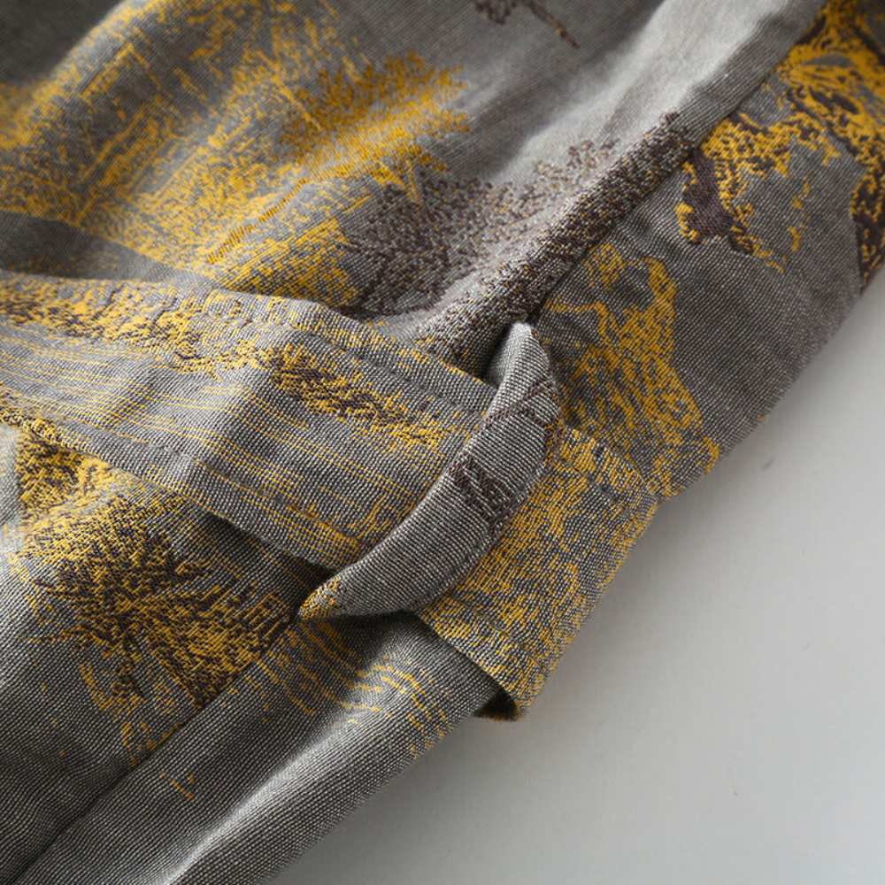 Gray kimono bathrobe fabric and belt with yellow patterned details.