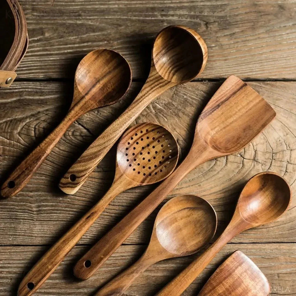 Natural brown teak utensil set with spoons and spatulas.