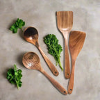 Wooden kitchen utensil set displayed for everyday cooking.