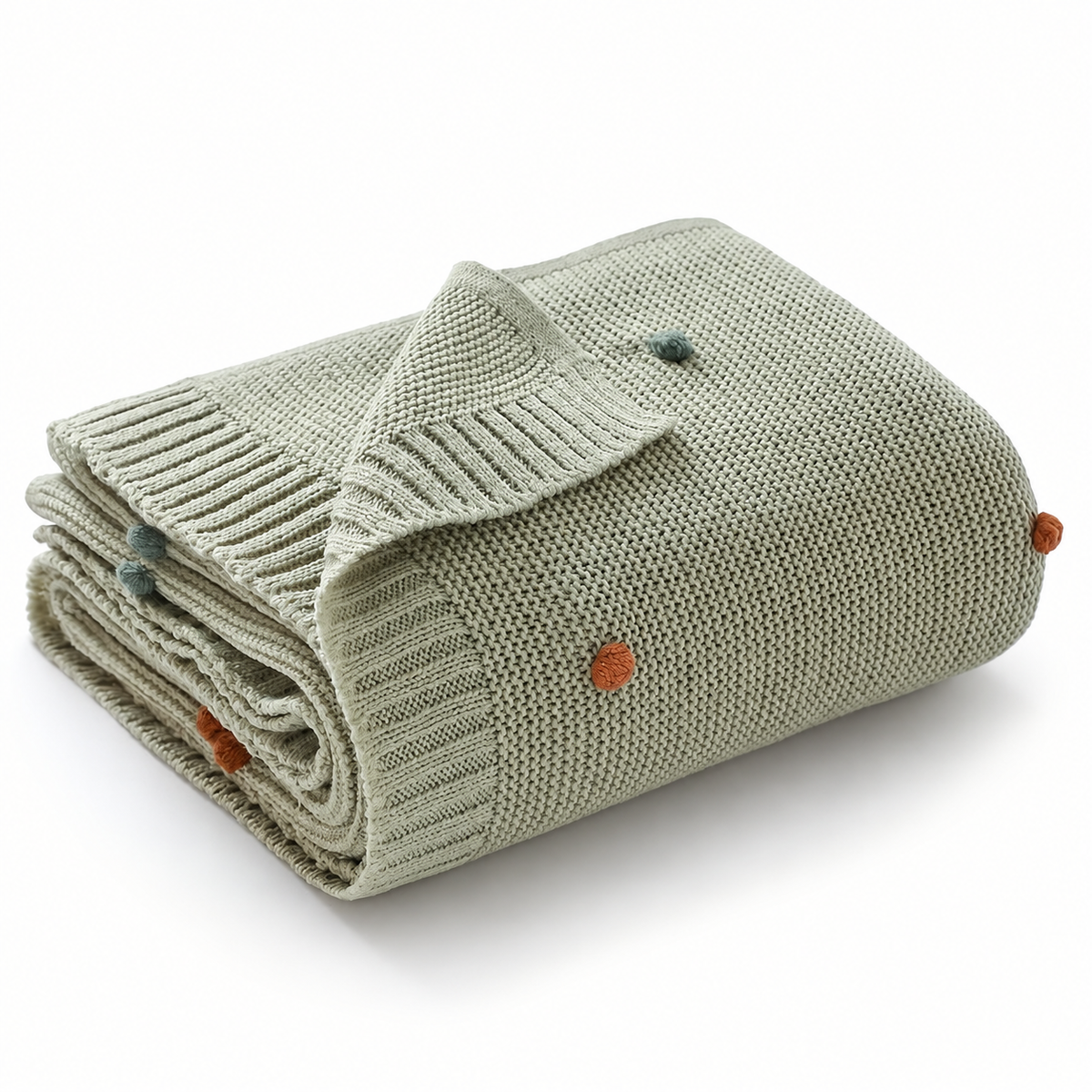 Rolled light green acrylic knit throw blanket showing its knit texture