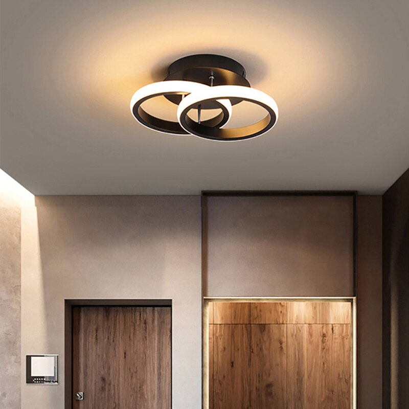Black circle LED ceiling light installed above a room