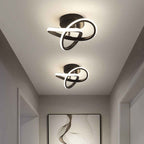 Black clover LED ceiling light fixtures shown on a hallway ceiling