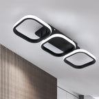 Black three frame LED ceiling light installed close to a white ceiling.