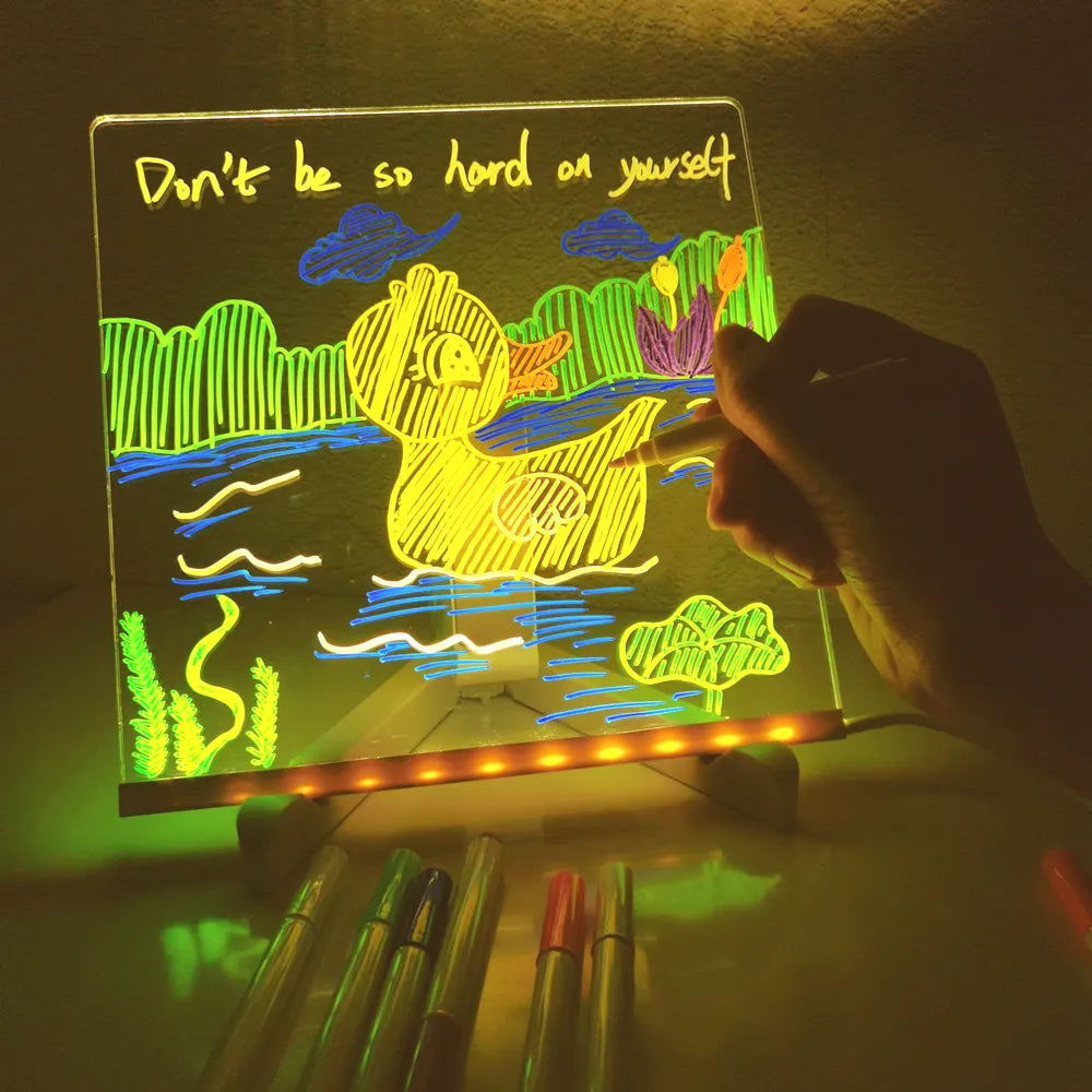 Hand drawing a colorful duck scene on the illuminated acrylic panel