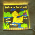 Finished duck illustration glowing on the clear LED message board