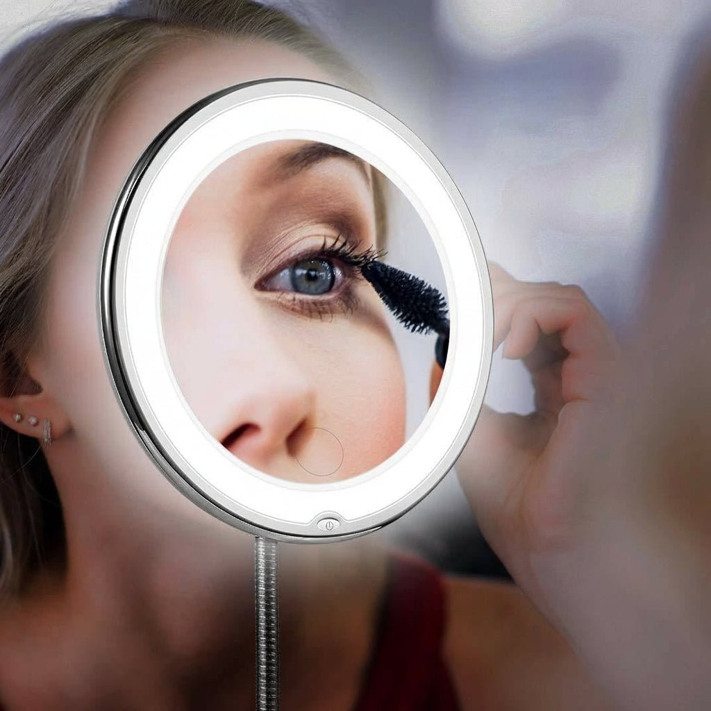 LED makeup mirror with a glowing ring reflecting an eye during mascara application.