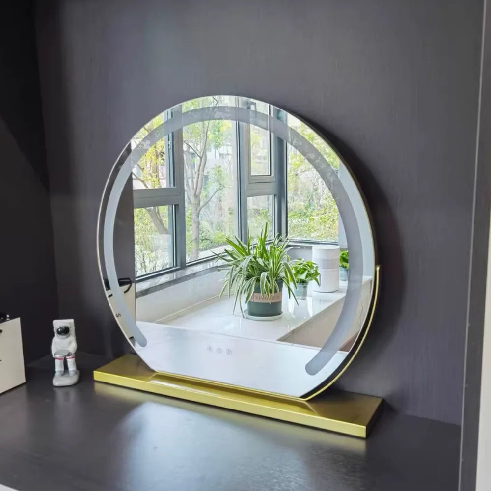 Gold lighted makeup mirror displaying the illuminated mirror surface.