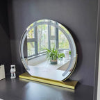 Gold lighted makeup mirror displaying the illuminated mirror surface.