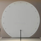 Lighted makeup mirror viewed at an angle to show the metal frame.