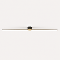 Black linear flush mount ceiling light glowing against a plain off-white background.