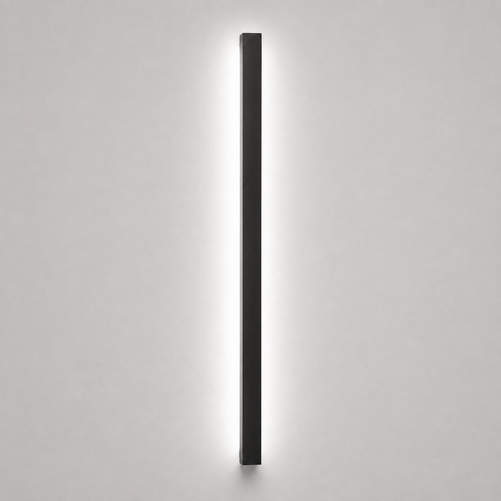 Slim wall sconce with a soft white glow on a light gray background.
