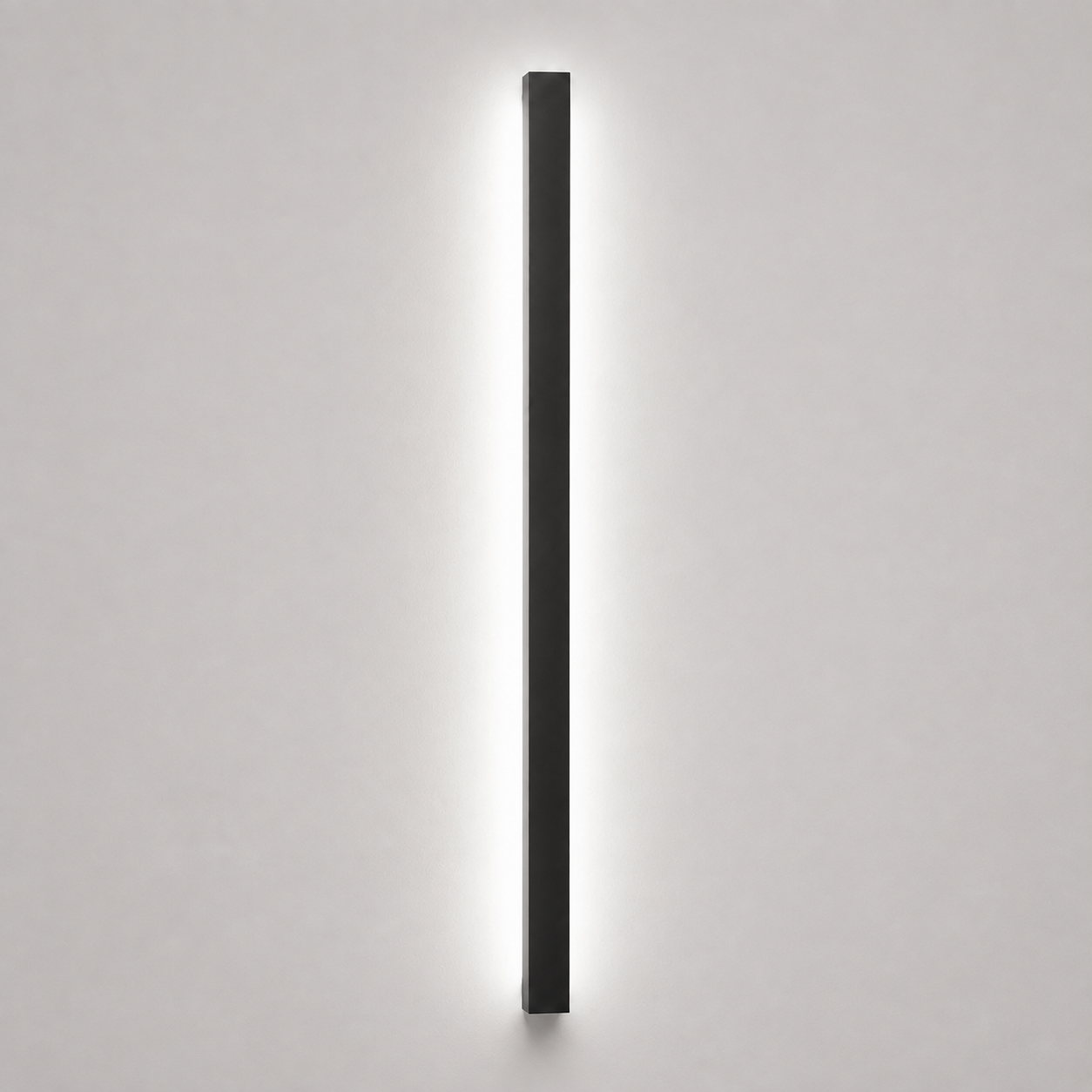 Slim wall sconce with a soft white glow on a light gray background.