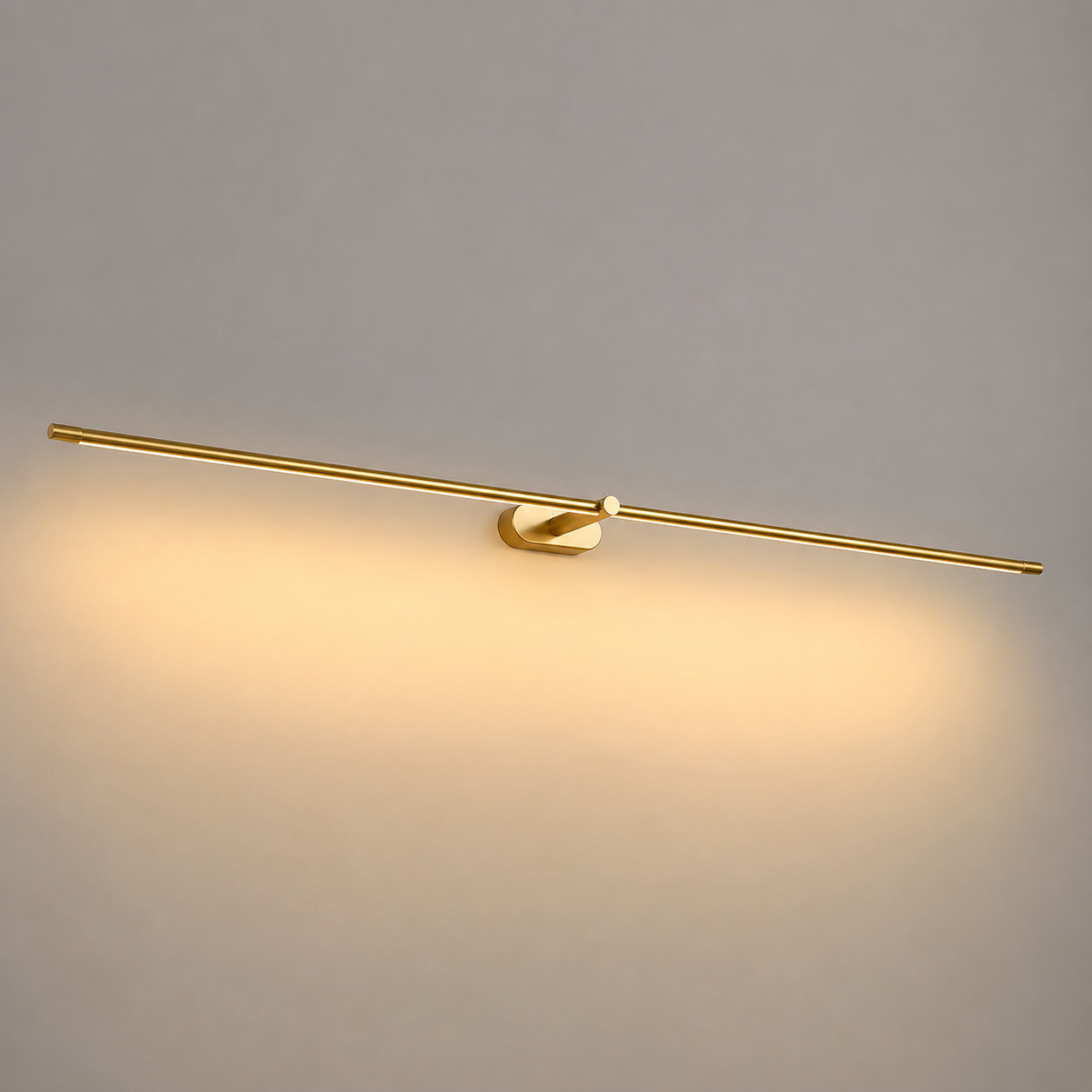 Linear wall sconce shown close up with warm downward lighting on a plain wall.