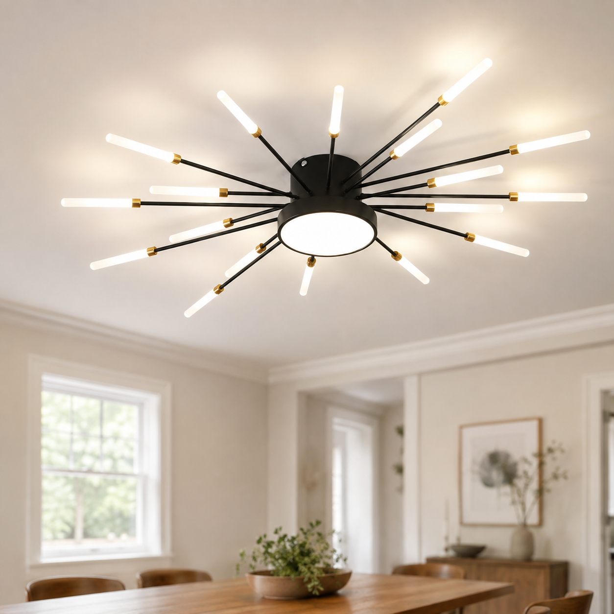 Black starburst ceiling light glowing in a bright living room with windows and a dining table.