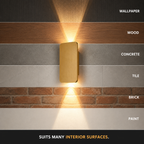 Gold rectangular wall sconce displayed against marble, wood, cement, brick, and tile surfaces.