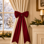 Long Velvet Christmas Bow — red bow tied around a curtain