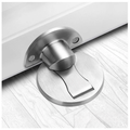 Silver magnetic door stop installed on a pale wood floor.