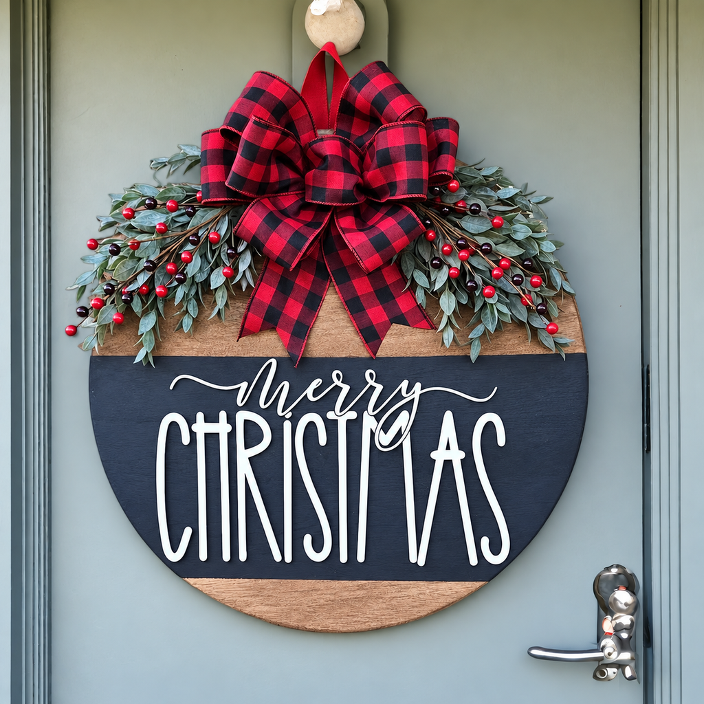 Round Merry Christmas door hanger with plaid bow on a pale green door