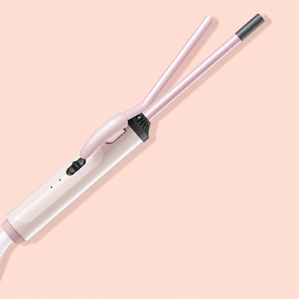 Pink mini curling iron with its spring clamp open