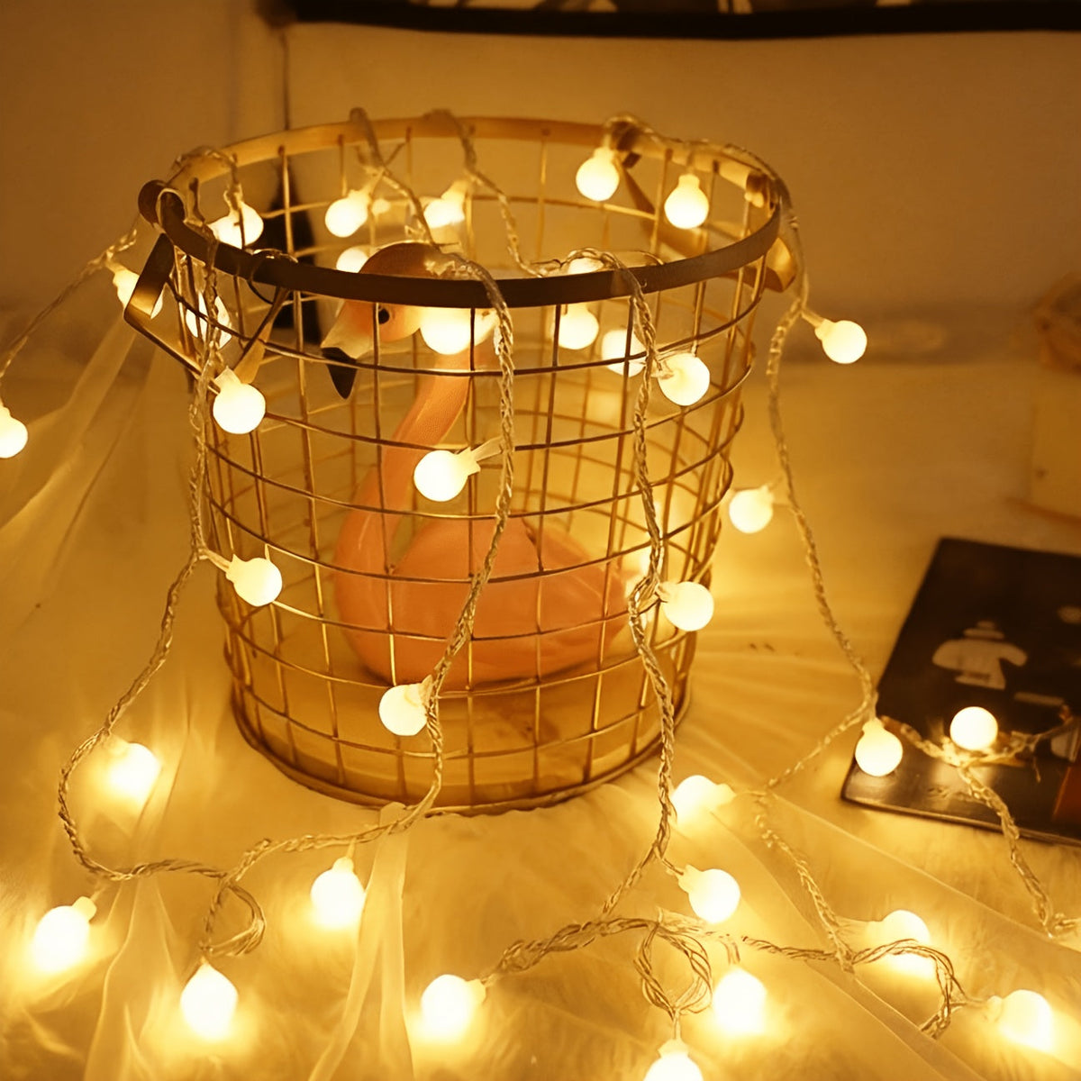 Warm white mini globe fairy lights around a decorative basket