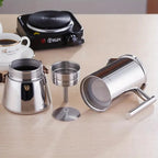 Italian moka pot shown with its heat-resistant black handle.