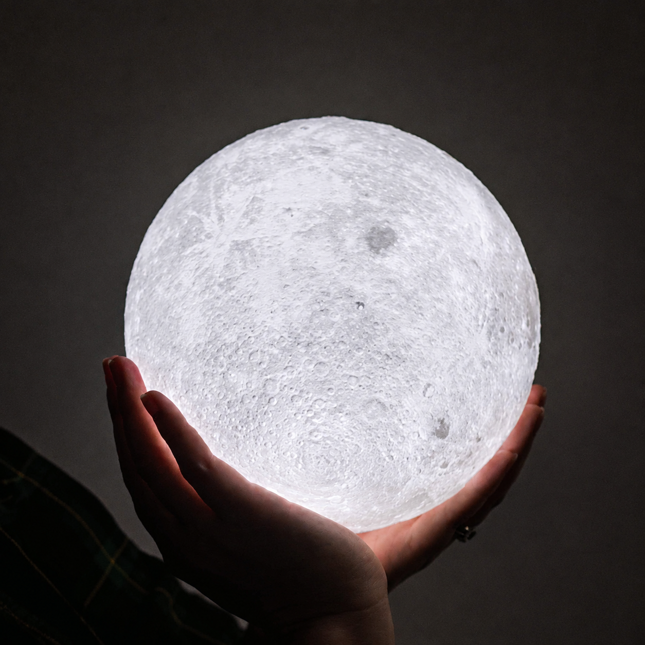 Moon lamp with cool white light on a minimalist desk