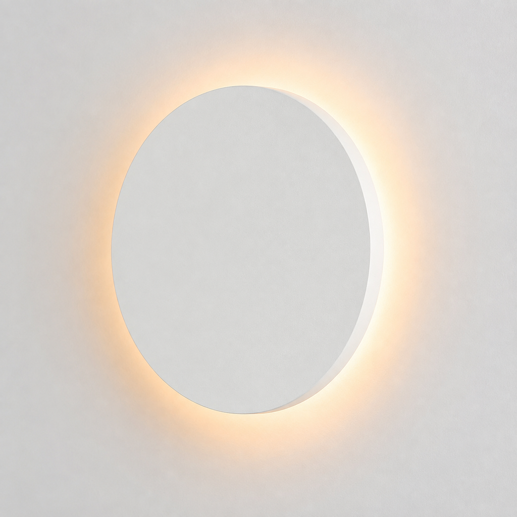 White round outdoor wall light glowing with a warm halo against a plain light background.
