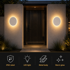 Two outdoor wall light fixtures glowing on either side of a dark front door with feature icons below.