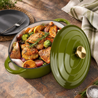 Olive green oval Dutch oven with gold tone lid knob