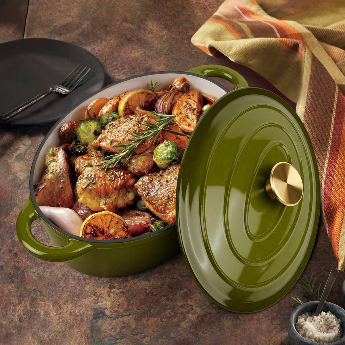 Olive green oval Dutch oven with food and matching lid