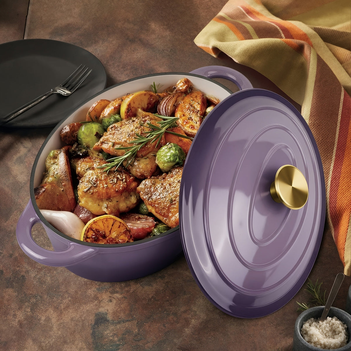 Lavender oval Dutch oven with food and matching lid