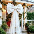 Oversized Christmas Bow — white bow and tulle tails on a porch