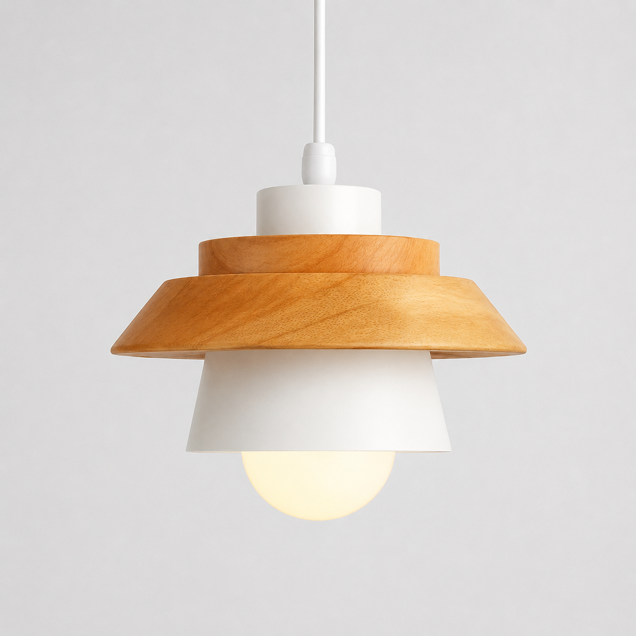 White cone pendant light with natural wood accent, glowing against a light gray background.