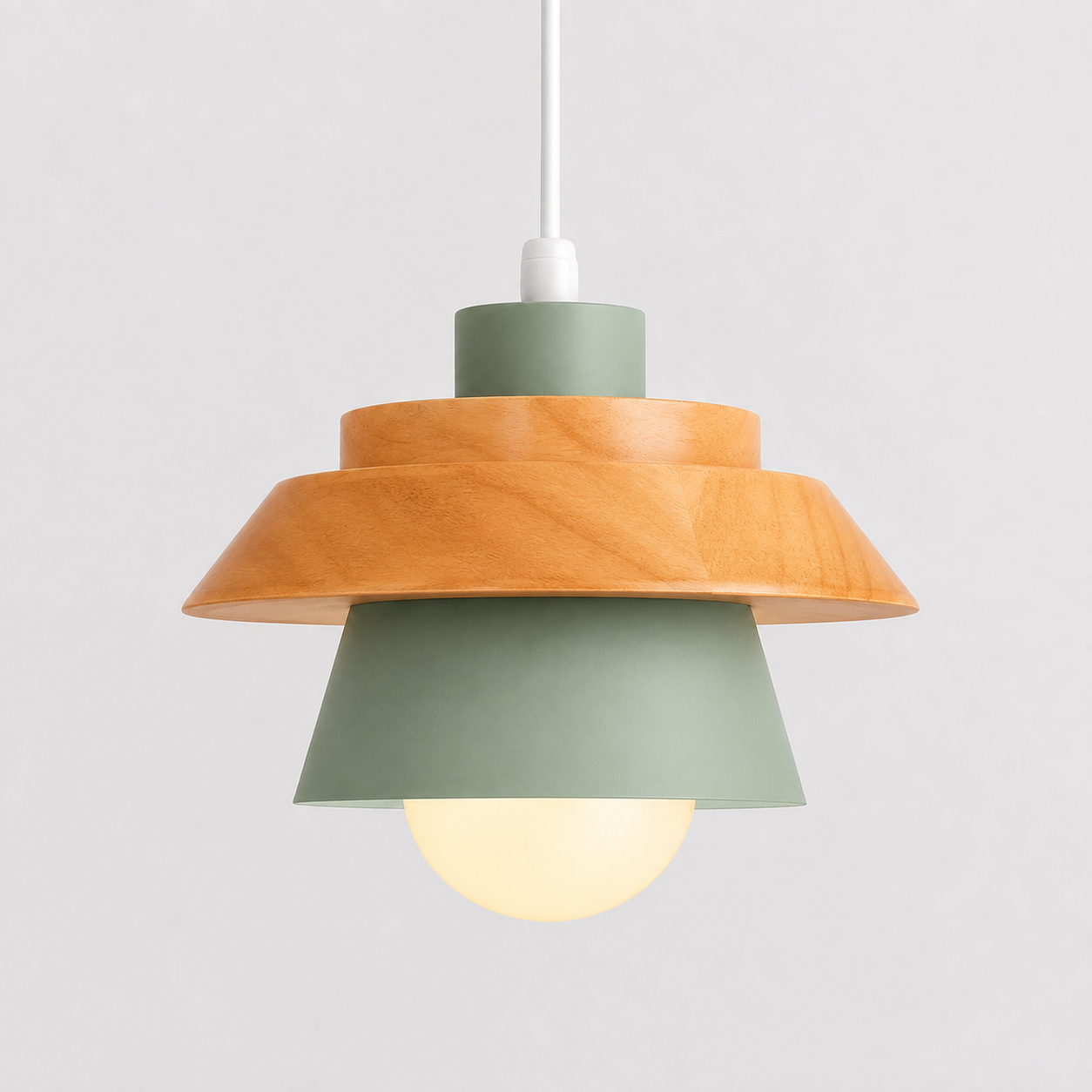 Green cone pendant light with natural wood accent, glowing against a light gray background.