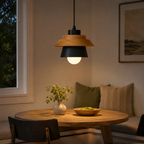 Nordic pendant light hanging in a styled interior with soft downward illumination.