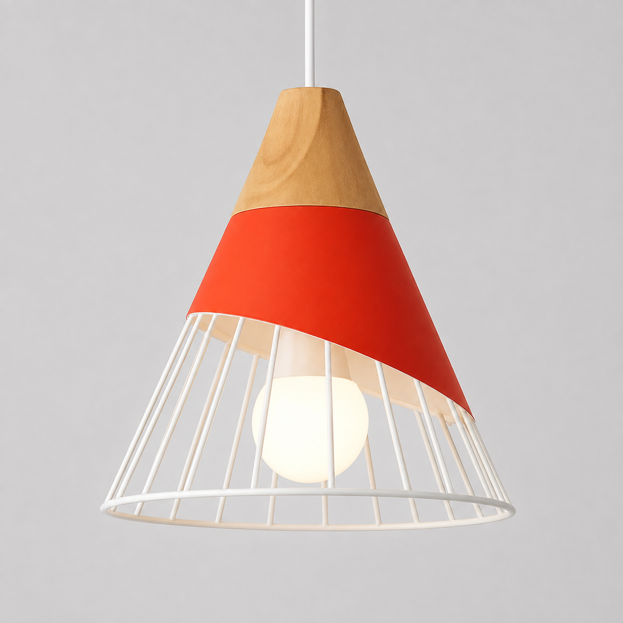 Red pendant light with a natural wood accent, white wire cage shade, and glowing bulb against a light gray background.