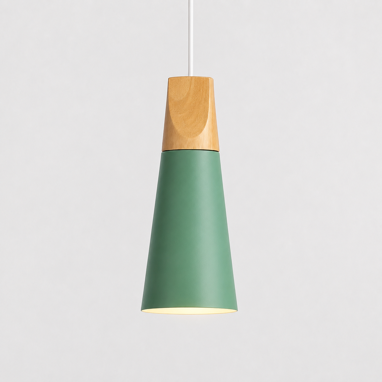 Green cone pendant light with a natural wood accent, illuminated against a light gray background.