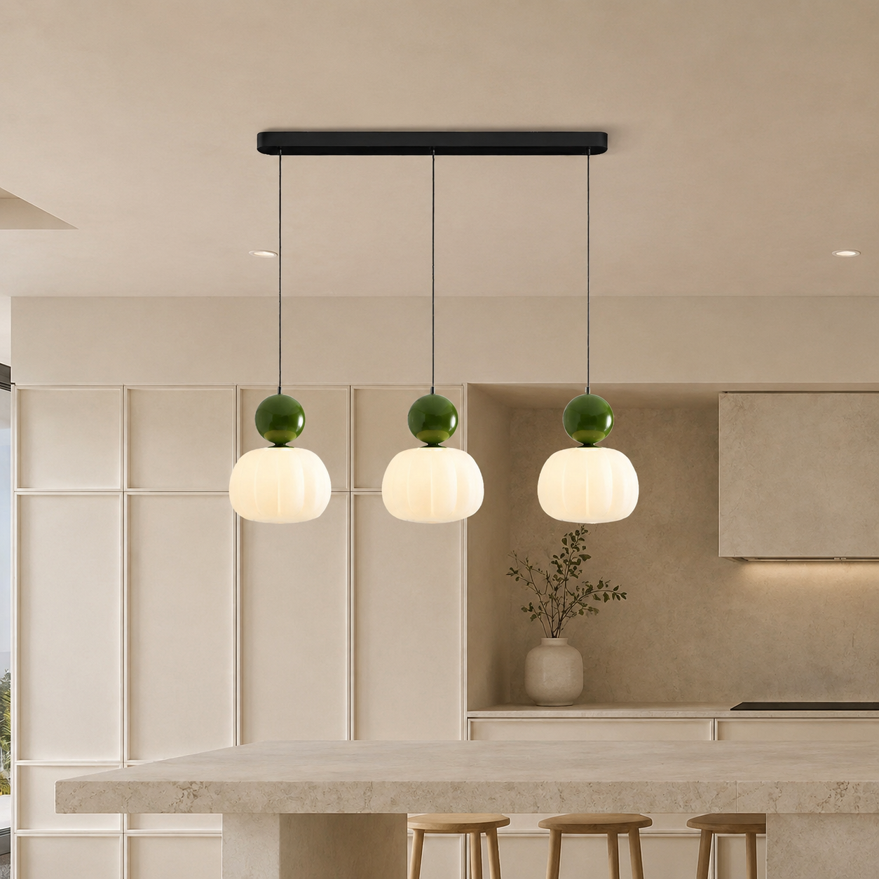 three green Bauhaus pendant light fixtures over a bright kitchen island