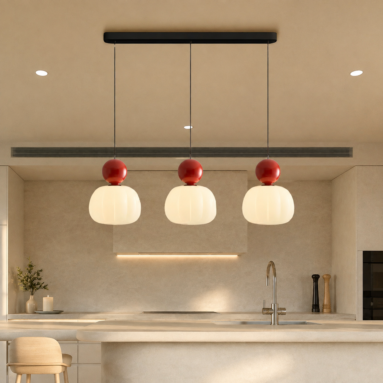 three red Bauhaus pendant light fixtures above a pale counter