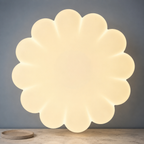 underside view of the glowing pleated Bauhaus pendant light shade