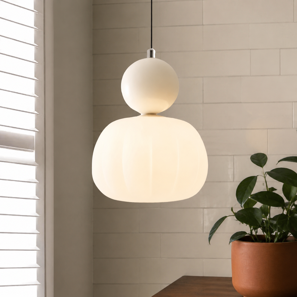 single beige Bauhaus pendant light against white tile