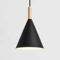 Black conical pendant light with a natural wood stem, glowing warm white against a neutral background.
