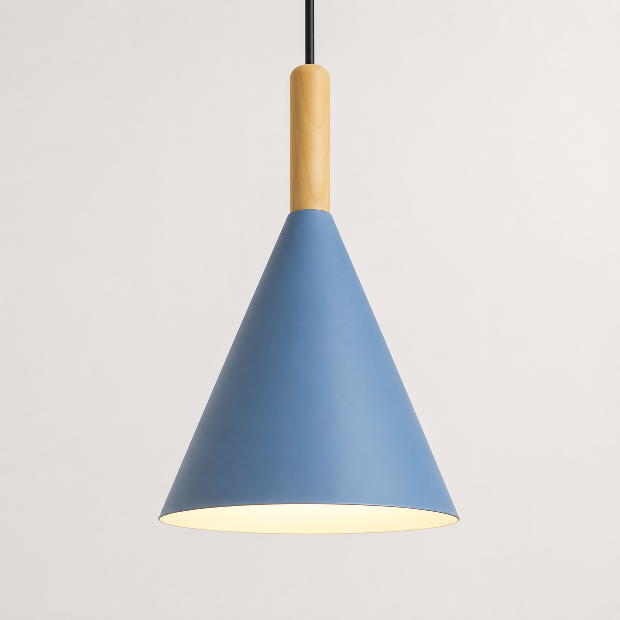 Blue conical pendant light with a natural wood stem, glowing warm white against a neutral background.
