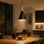 Black conical pendant light with a natural wood stem, glowing warm white above a modern wooden dining table.
