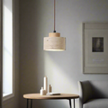 Pendant light with natural stone drum shade and light wood accent