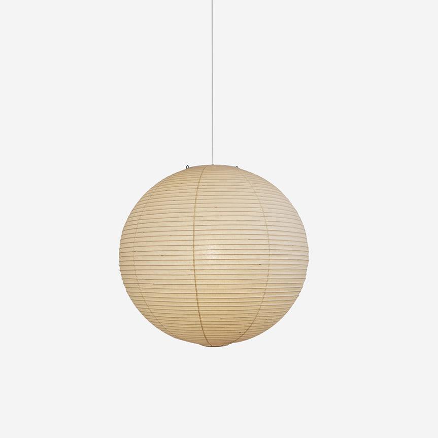 Pendant light with a round ribbed paper shade and white suspension wire