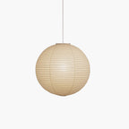Pendant light with a round ribbed paper shade and white suspension wire