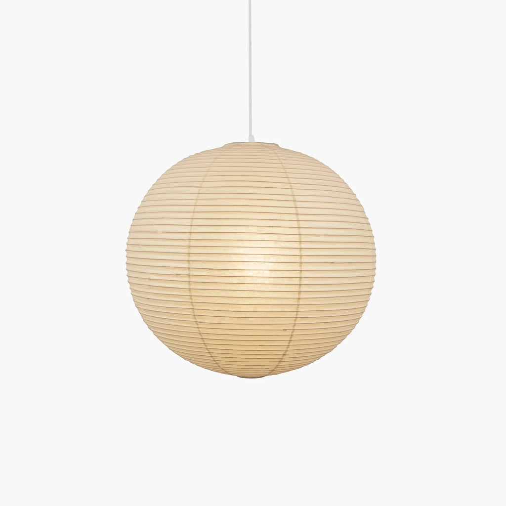 Pendant light with a round ribbed paper shade and white suspension wire