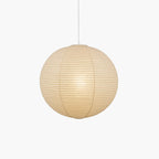 Pendant light with a round ribbed paper shade and white suspension wire