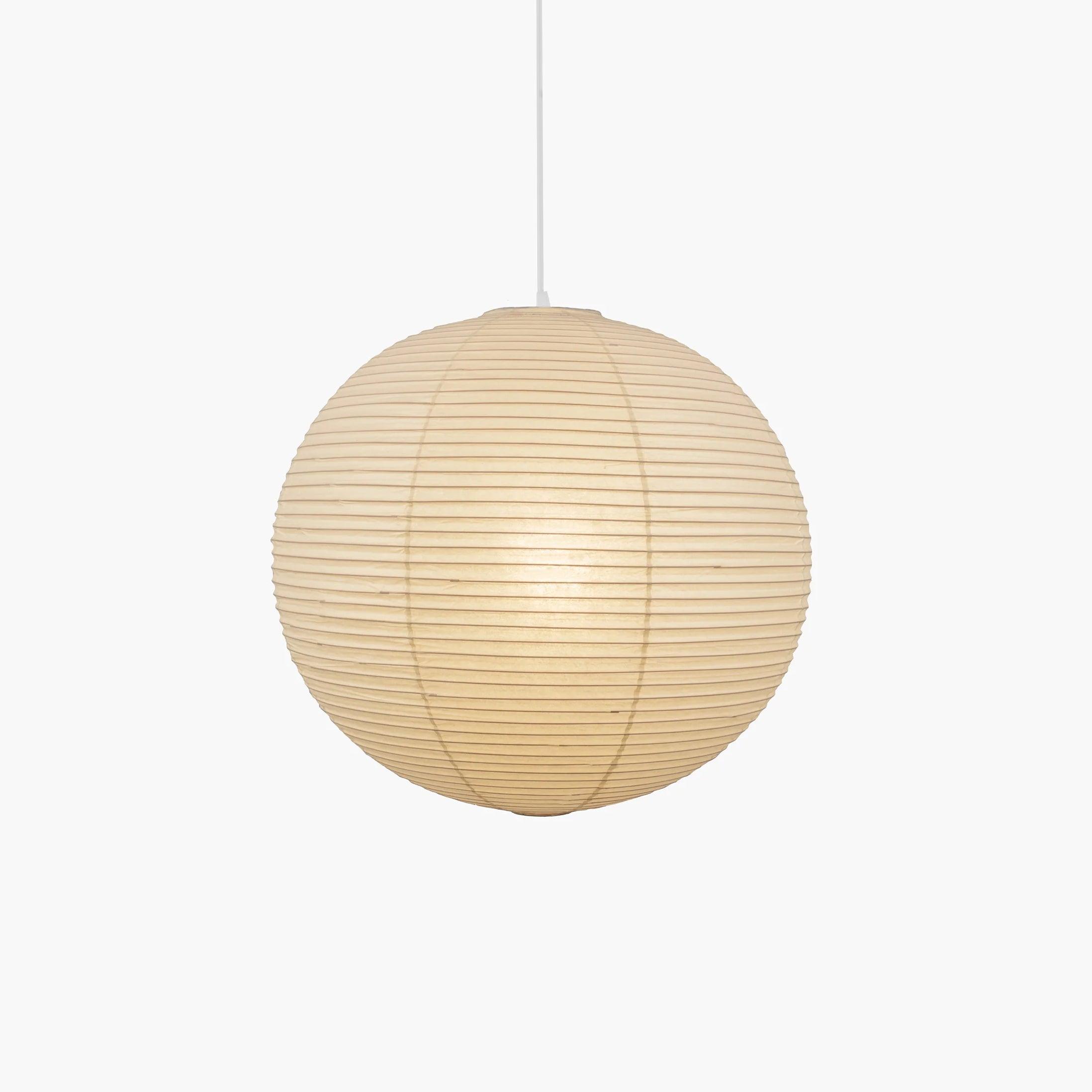 Pendant light with a round ribbed paper shade and white suspension wire